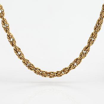 An 18K gold necklace. Unoaerre, Italy.