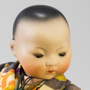 Two oriental bisque head baby dolls by Armand Marseille and Heubach Köppelsdorf, Germany, early 20th century.