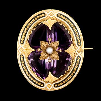 A BROOCH, facetted amethysts, enamel, 18K gold. France, 19th century.