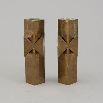 A pair of brass candlesticks by Pierre Forssell for Skultuna.