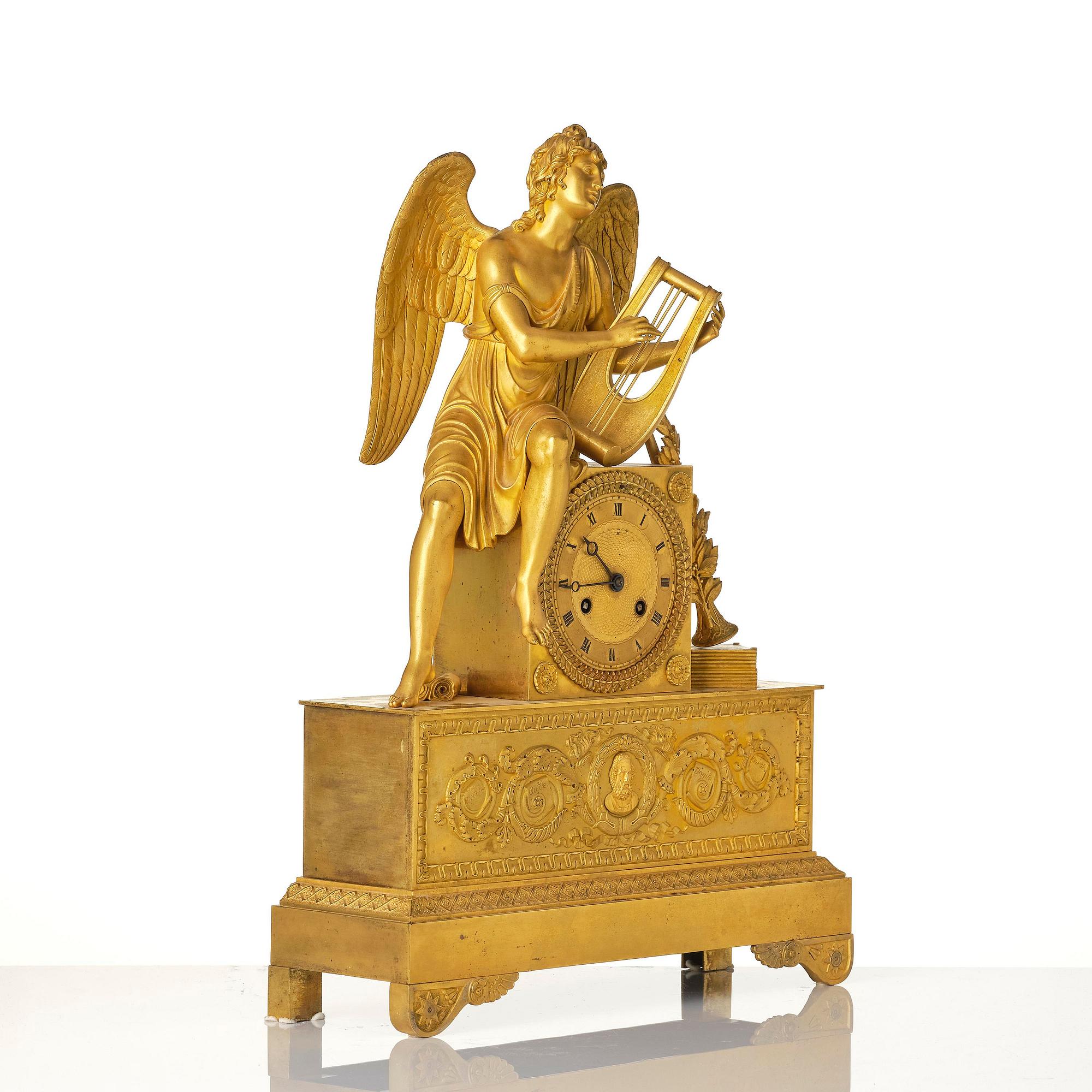 A figural Empire ormolu mantel clock, Paris, early 19th century.