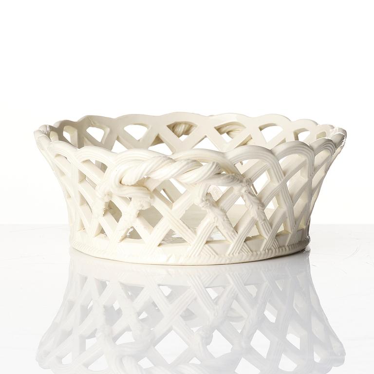 A latticed creamware chestnut basket with stand, 19th century.