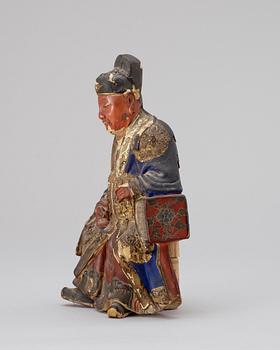 A polychrome wood figure, late Qing dynasty (1644-1912).