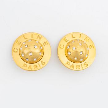 Céline, a pair of gold tone and rhinestone clip-on earrings.