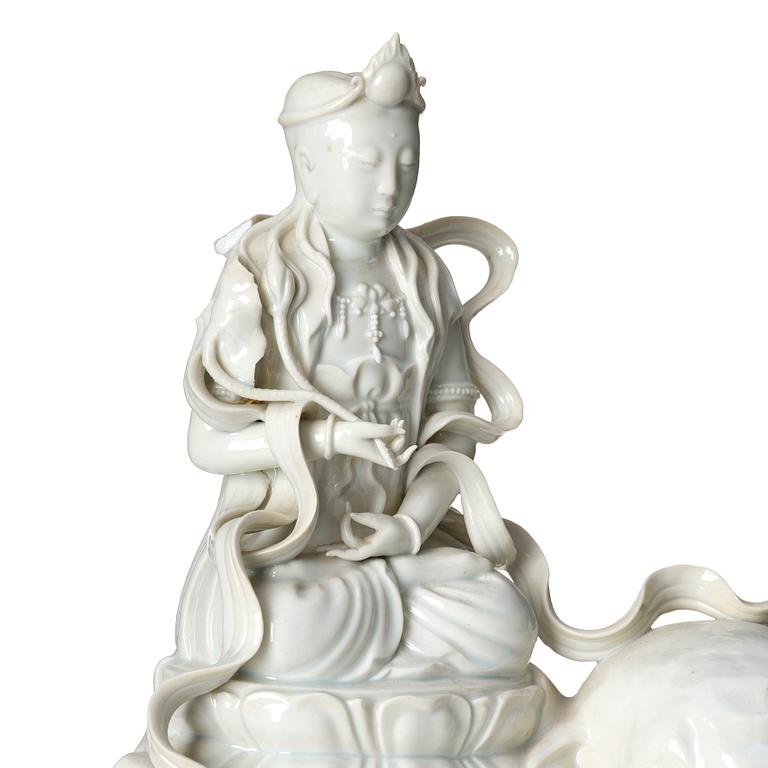 A large blanc-de-chine figure of Guanyin riding an elephant, late Qing dynasty/early 20th Century.