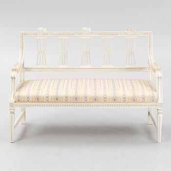 A sofa, three chairs and a table, Gustaivan style and of the Gustavian period, 19th-20th century.