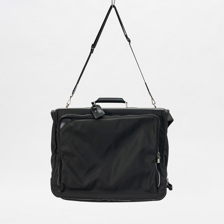 Louis Vuitton, a green canvas and Taiga garment bag.