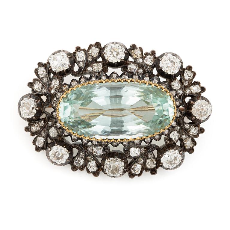 Brosch silver och guld med en fasettslipade  akvamarin och gammalslipade diamanter.