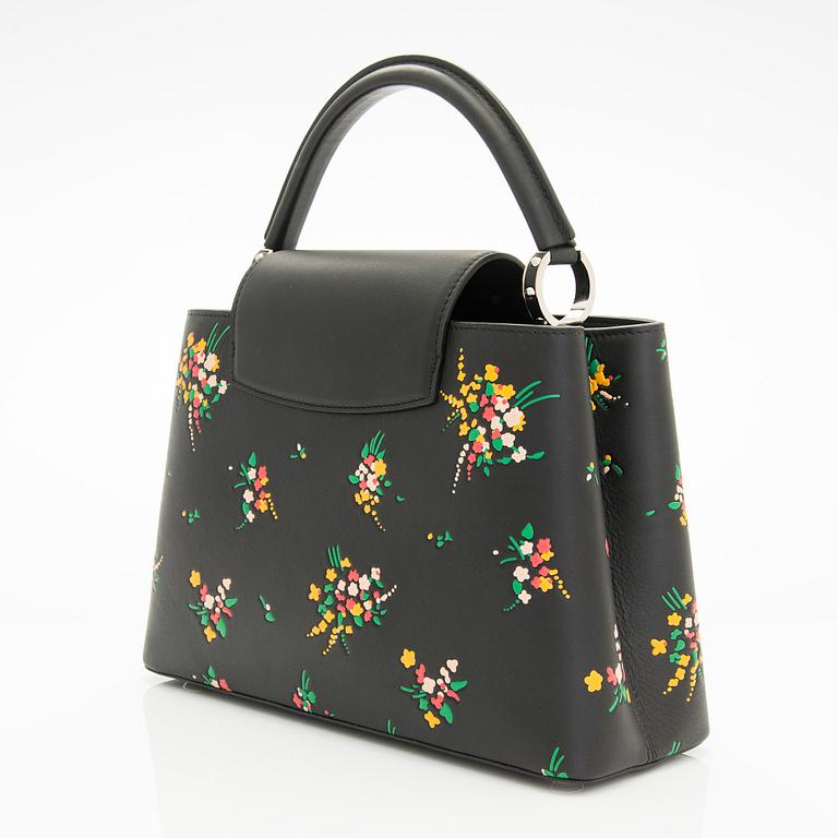 Louis Vuitton, a "Blossom Capucines PM" leather handbag.