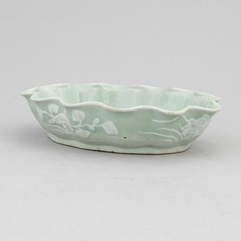 A Chinese celadon glazed lotus leaf shaped bowl, late Qing dynasty, and a ge-glazed brush washer, possibly 20 century.