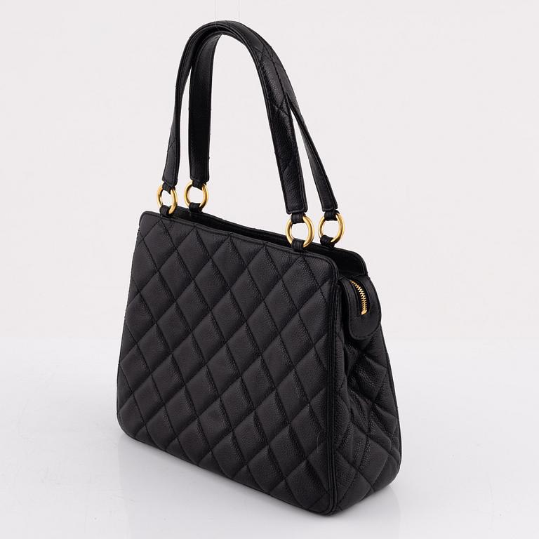 Chanel, a black caviar leather bag, 1997-1999.