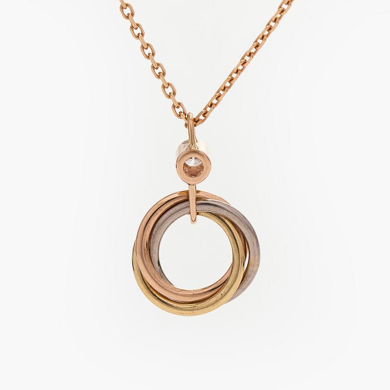 Cartier, an 18K gold 'Trinity Pendant' necklace with a brilliant-cut diamond.