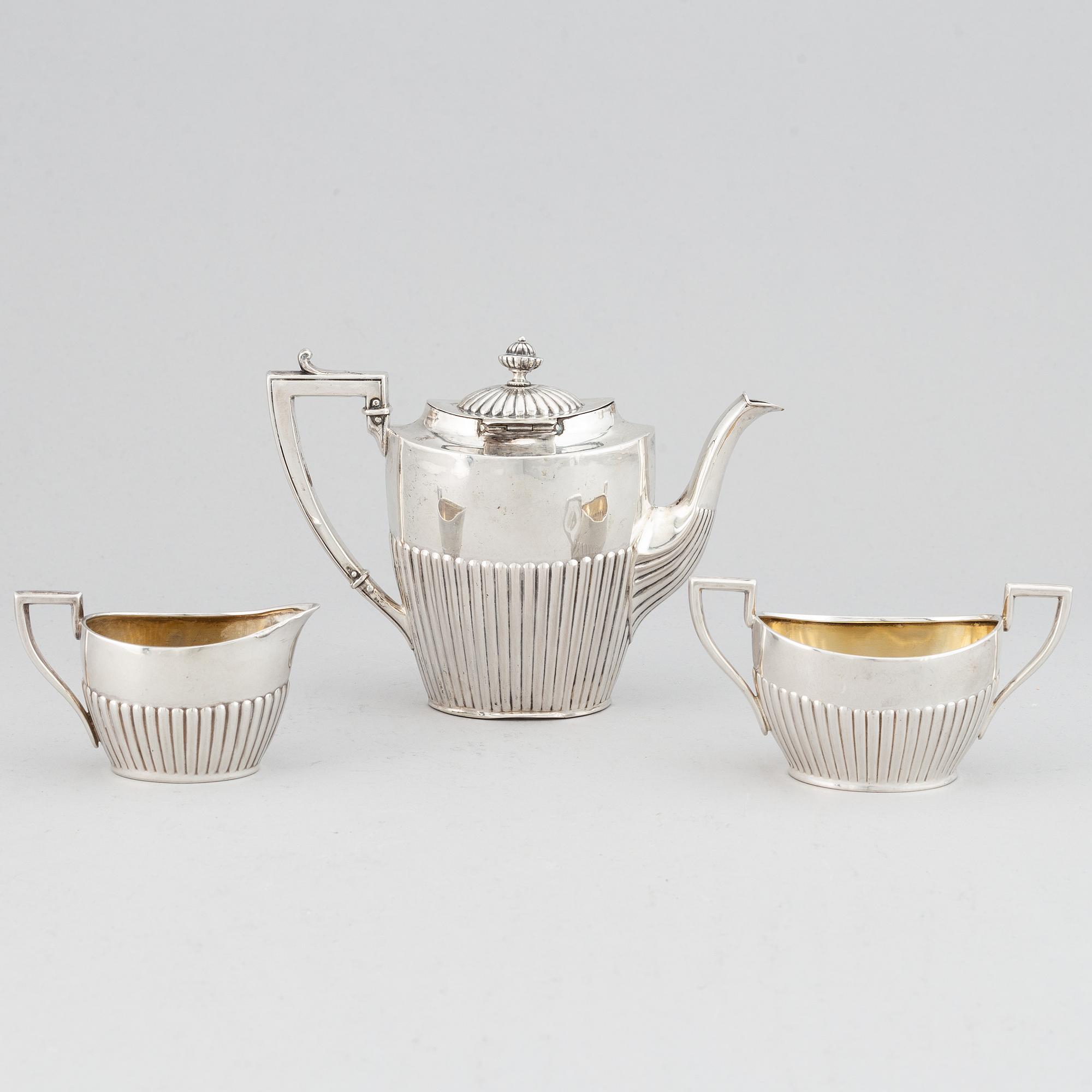 A silver mocha pot, creamer and sugar bowl, swedish import mark of NL Dahlström & Co, Örebro 1930.
