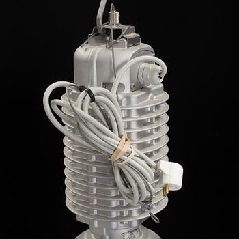 An industrial ceiling lamp marked Zumtobel Staff.