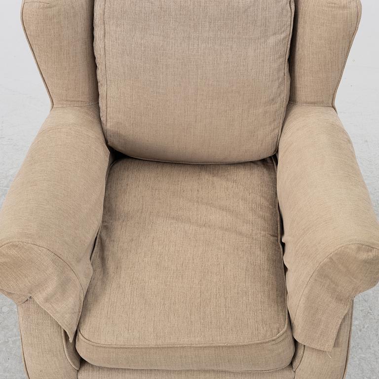 An armchair with footstool, Howard model, Englessons, 21st century.