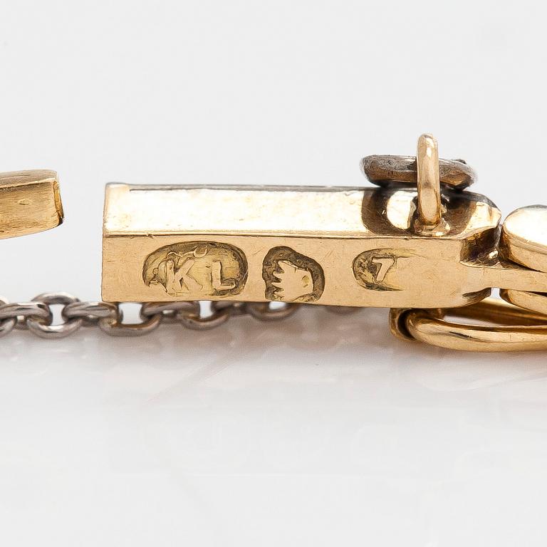 Rannekoru, 18K kultaa timantteja yhteensä noin 0.50 ct. Suomalaiset leimat.