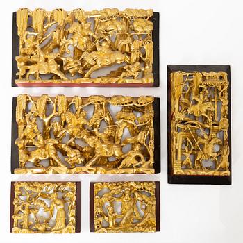 Five wooden decorations, China, 20th century.