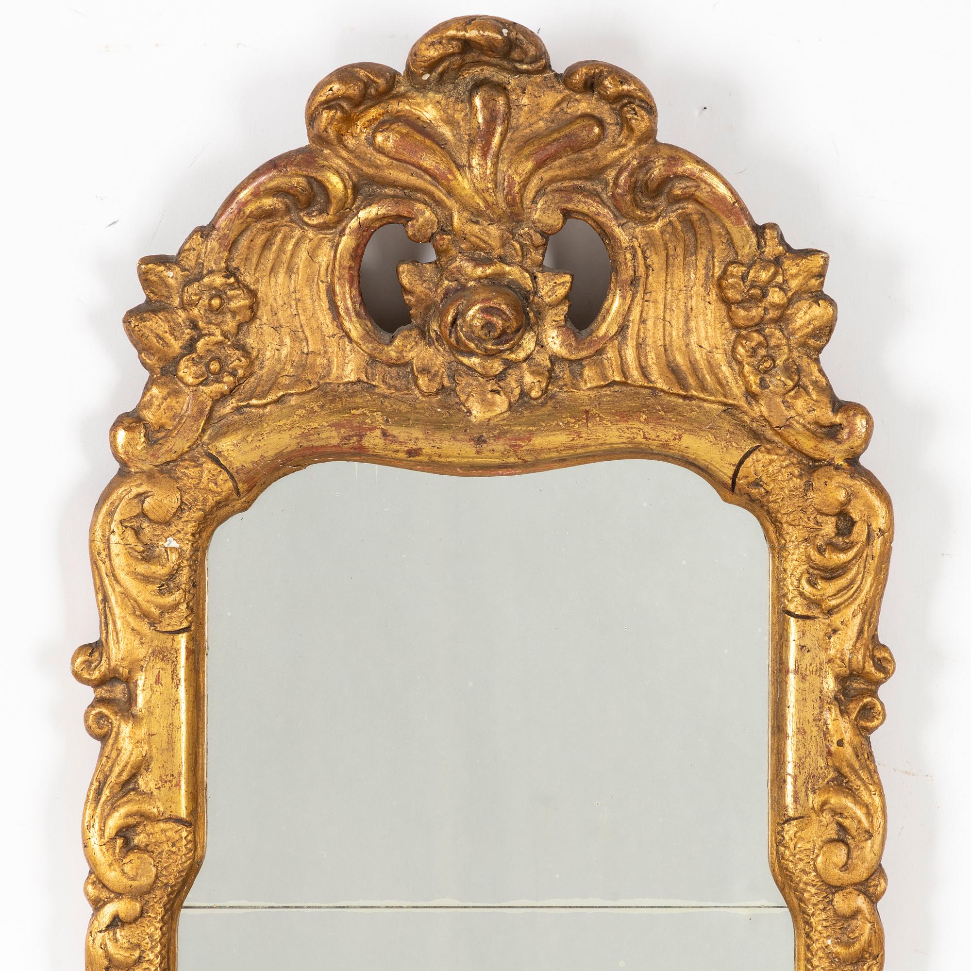 A Rococo mirror, 18th Century.