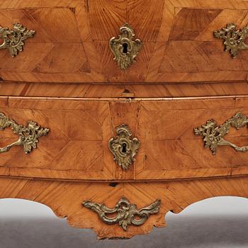 A brass-mounted and marquetry rococo commode, later part of the 18th century.