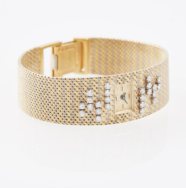 DAMARMBANDSUR, 18K guld med briljantslipade diamanter, ca 0.70 ct. Numa.