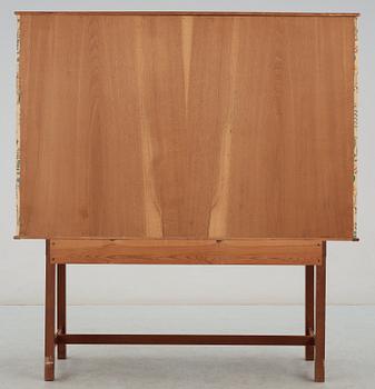 A Josef Frank mahogany cabinet, doors and sides covered in Frank's floral chintz fabric 'Fatima', Svenskt Tenn ca 1937.