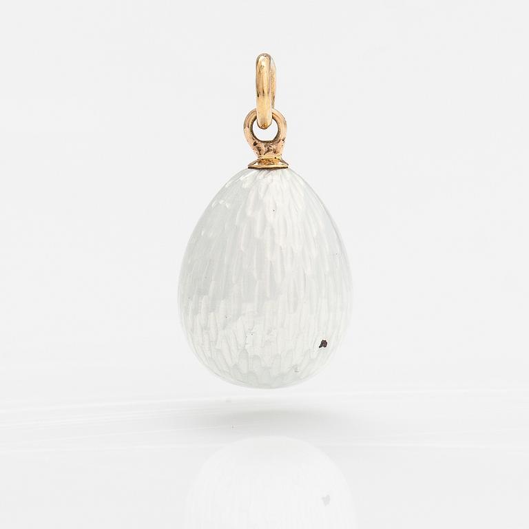 A silver, 14K gold and enamel egg shaped pendant.