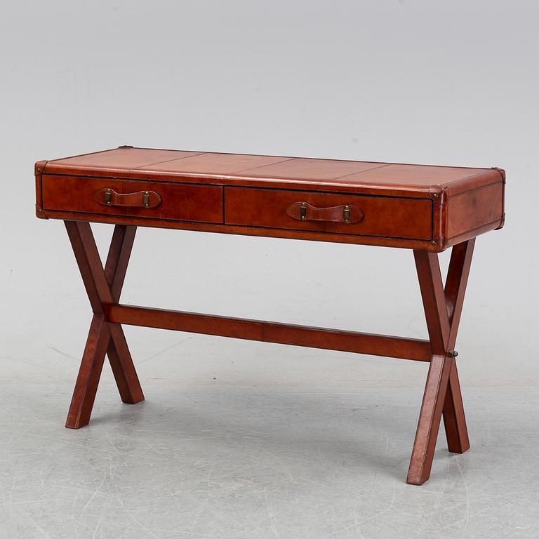 A contemporary dressing table with stool.