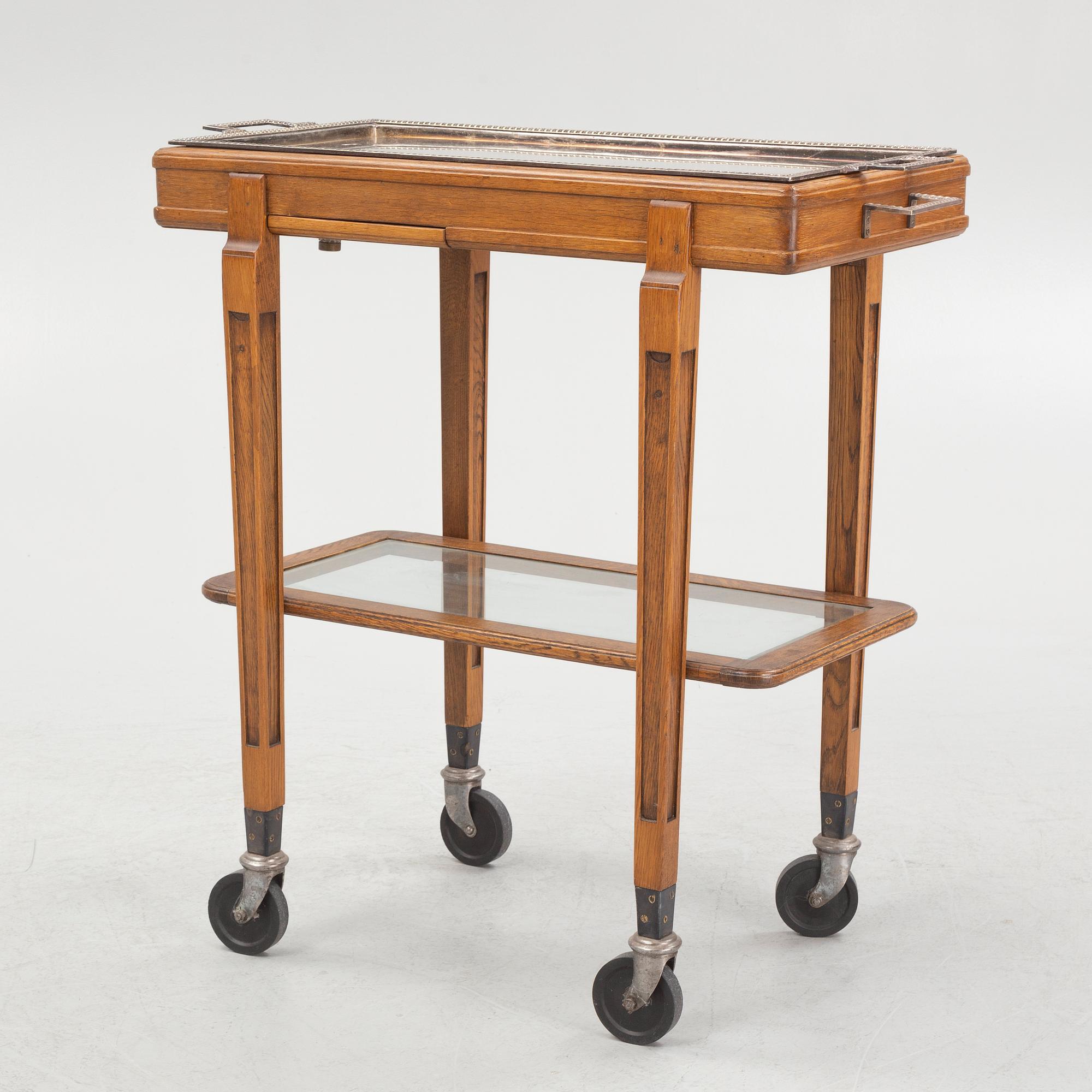A restaurant serving trolley with silver plate dishes, first half of the/mid 20th century.