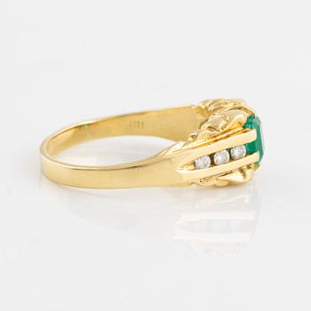 Emerald and brilliant cut diamond ring.