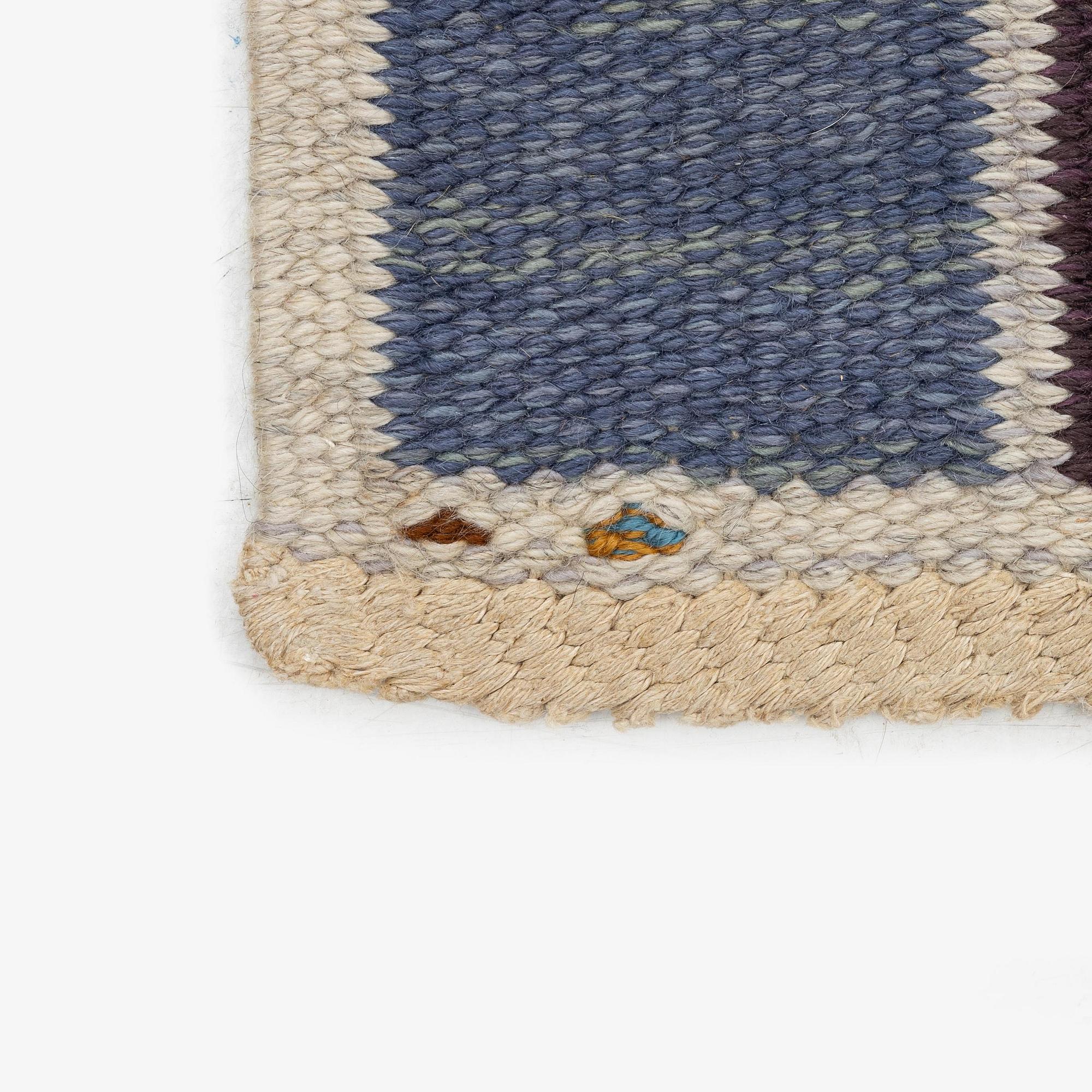 Barbro Nilsson, a carpet, 'Salerno blå med enkel bård', flat weave, c. 365 x 244 cm, signed AB MMF BN.