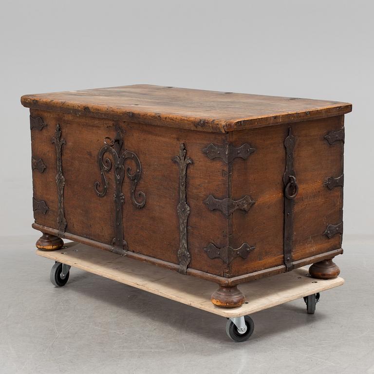 A large 17/17th century baroque oak chest with wrought iron fittings.