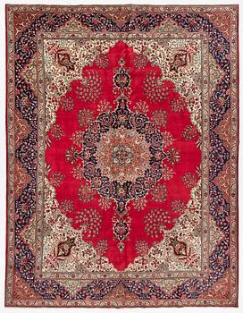 A Tabriz carpet, c. 393 x 300 cm.
