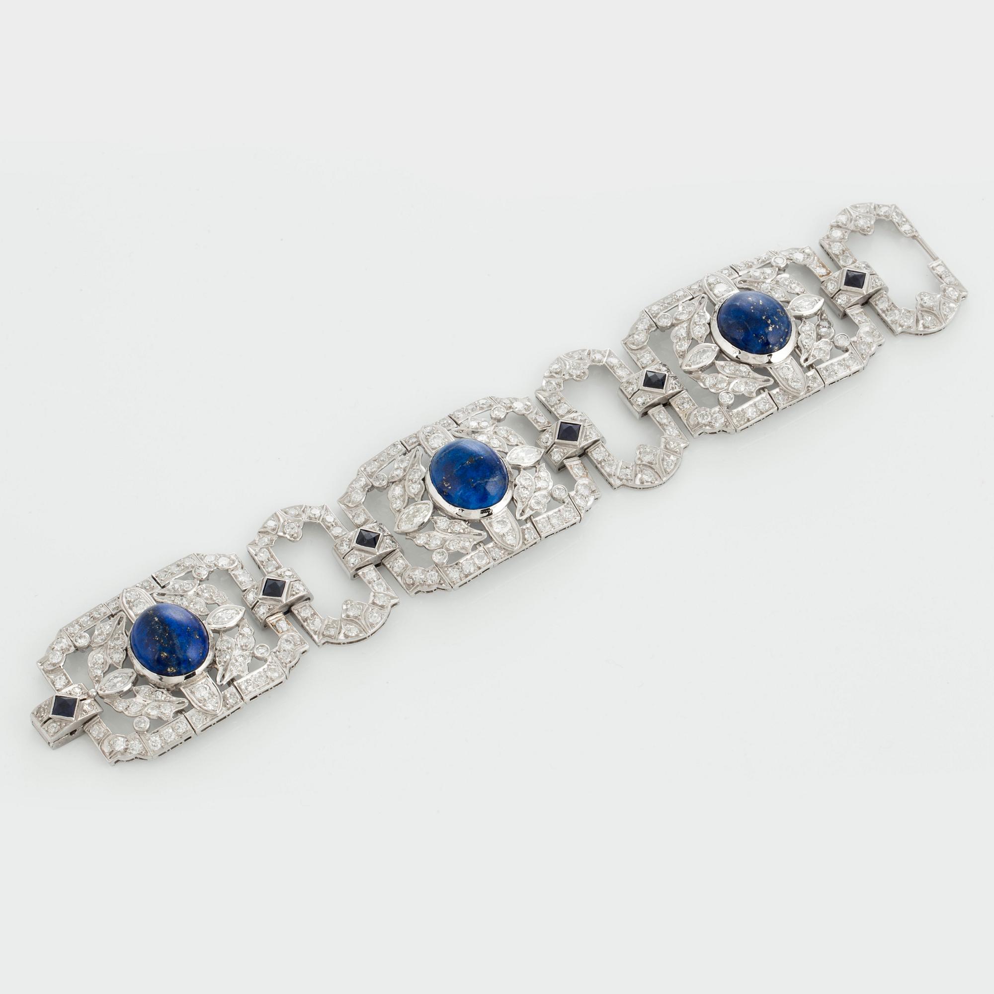 A platinum bracelet set with lapis lazuli, old-cut diamonds with a total weight of ca 10 cts and synthetic sapphires.