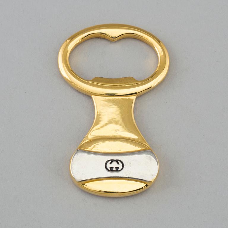 GUCCI, bottle opener.