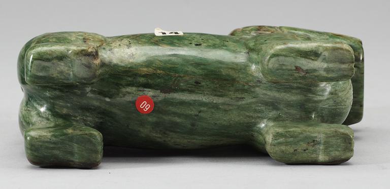 A nephrite figure of a Buddhist Lion, late Qing dynasty.