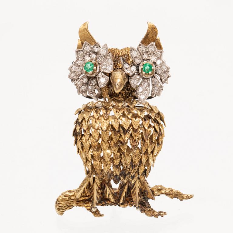 An 14K white and red gold brooch set with single cut diamonds and possibly emeralds.