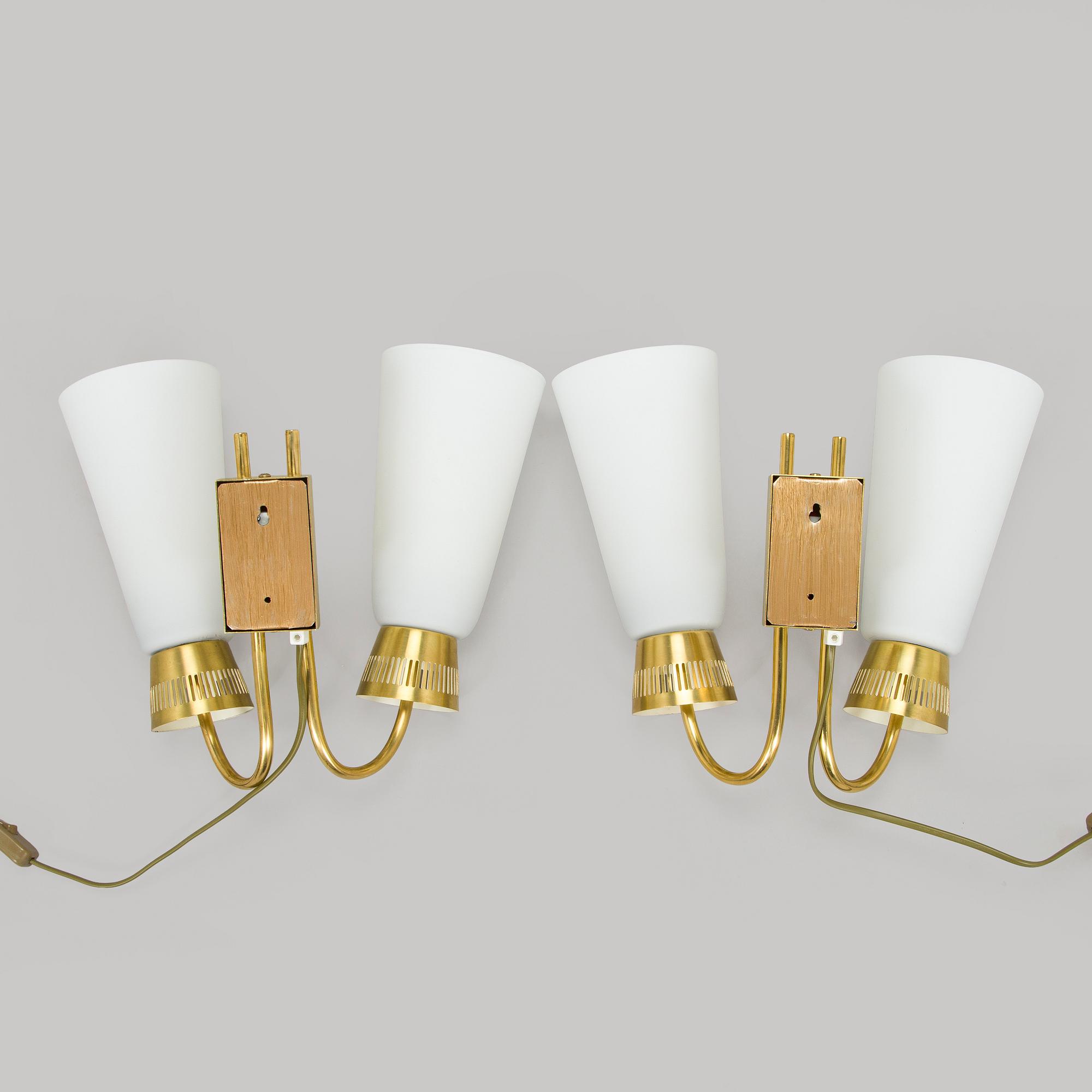 A pair of mid-20th century wall lights, model EY60, Itsu, Finland.