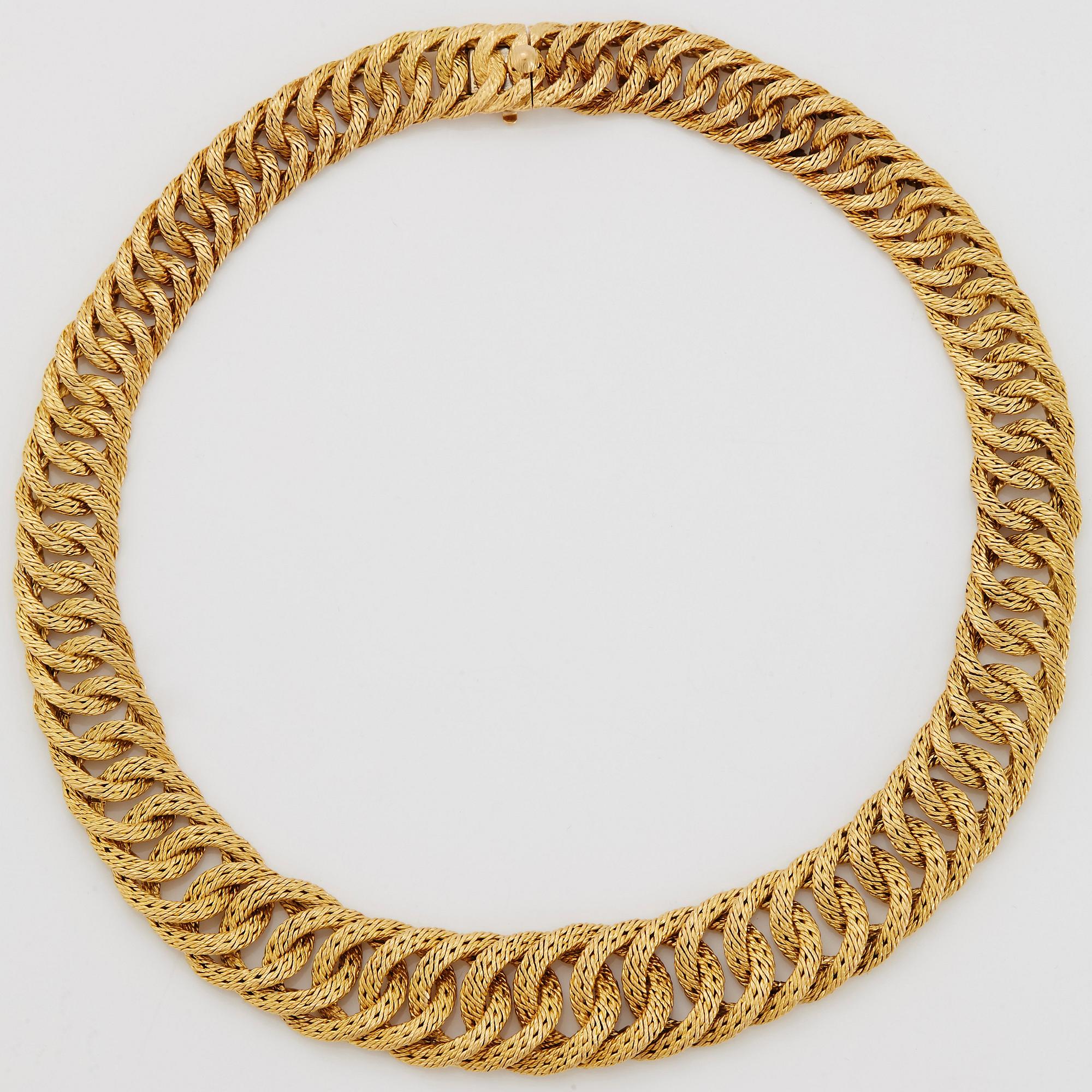 Georges L'Enfant an 18K gold demi parure comprising a necklace, a bracelet and a ring.