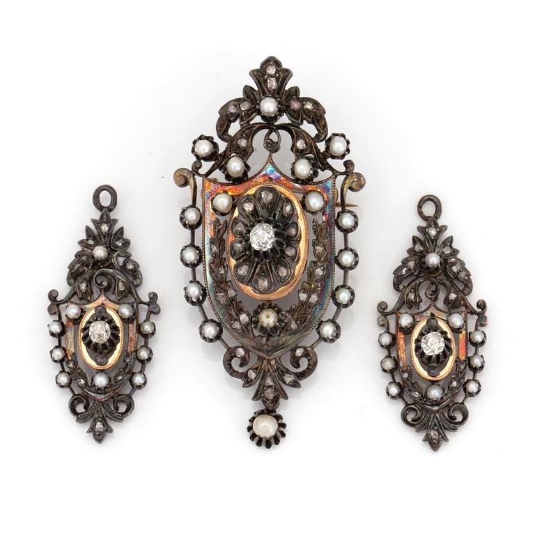 A silver gilt demi-parure set with old-cut diamonds, cultured and probably natural pearls.