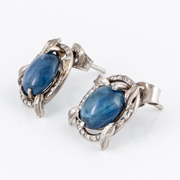 Cabochon-cut sapphire and brilliant-cut diamond earrings.