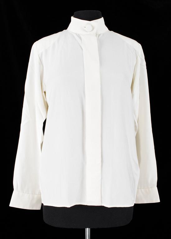 A set of two silk blouses by Yves Saint Laurent.