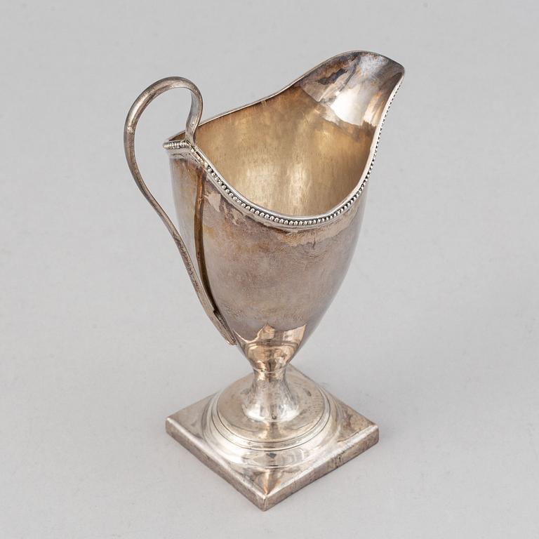 An English 18th century silver cream-jug, mark of John Lambe possibly, London 1786.