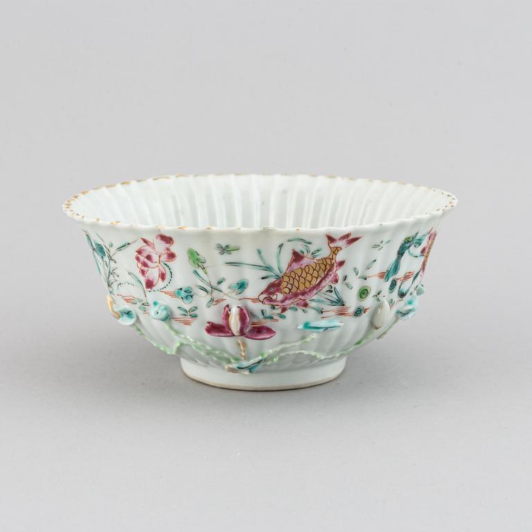 A famille rose relief moulded bowl, Qing dynasty, 18th century.