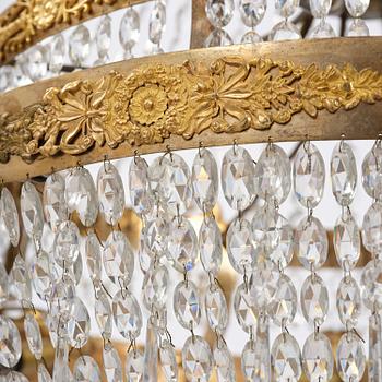 An ormolu and cut glass sixteen-branch Empire chandelier, Paris, early 19th century.