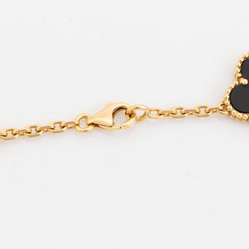 A Van Cleef & Arpels "Alhambra" necklace in 18K gold and onyx.