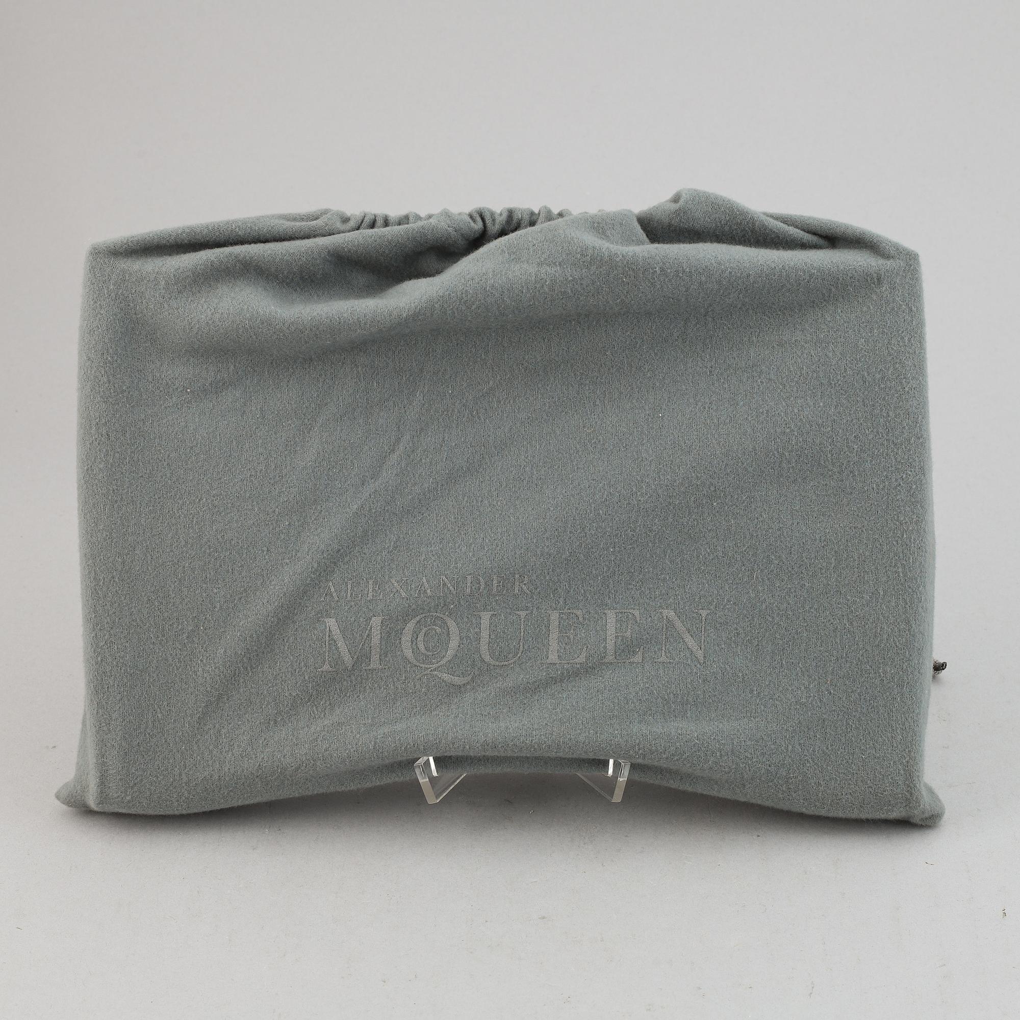 Alexander McQueen, a fabric clutch.