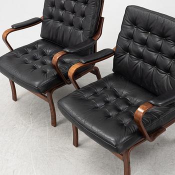 A pair of beechwood and leather armchairs, Göte Möbler, Nässjö, Sweden, second half of the 20th century.