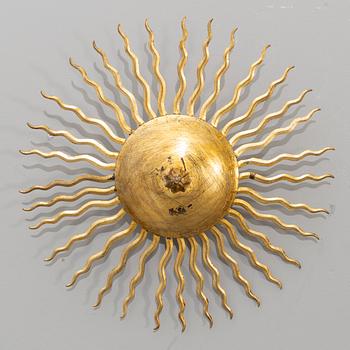 A ceiling lamp in the shape of the sun. Mid 20th century.