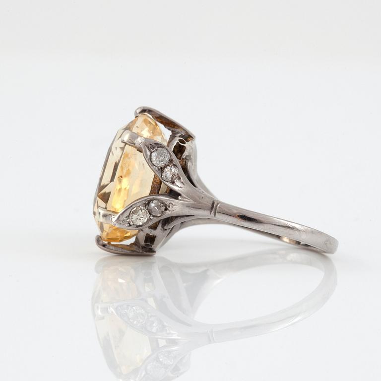 A yellow sapphire, circa 12.26 ct, ring.