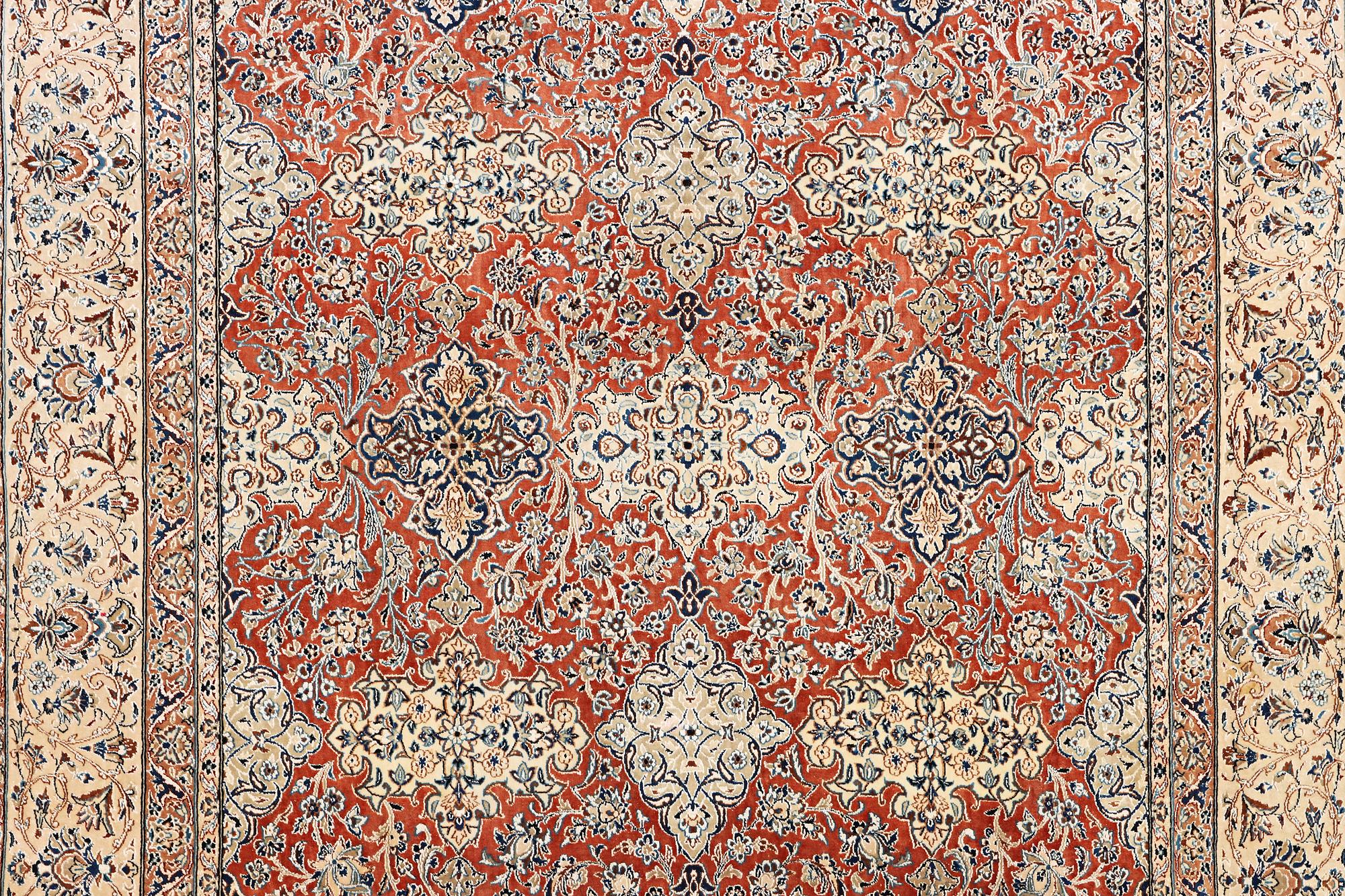 A semi-antique/old Nain carpet, part silk, c. 343 x 230 cm.